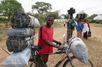 Man Hauling Charcoal on Bike